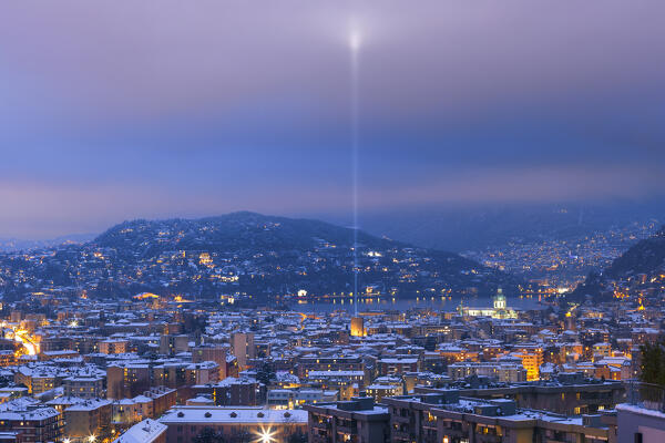 A night view on Como city after the snowfall with Christmas Light Tree event, lake Como, Lombardy, Italy, Europe