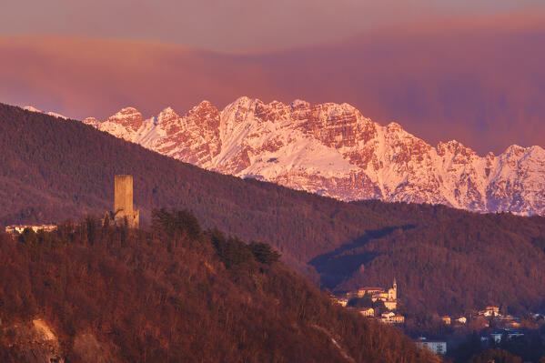 Sunset on Baradello tower (Como city) and Resegone mount (Lecco province), lake Como, Lombardy, Italy, Europe