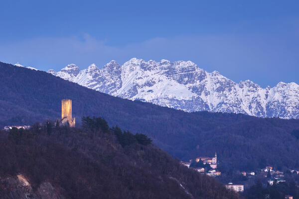 Dusk on Baradello tower (Como city) and Resegone mount (Lecco province), lake Como, Lombardy, Italy, Europe