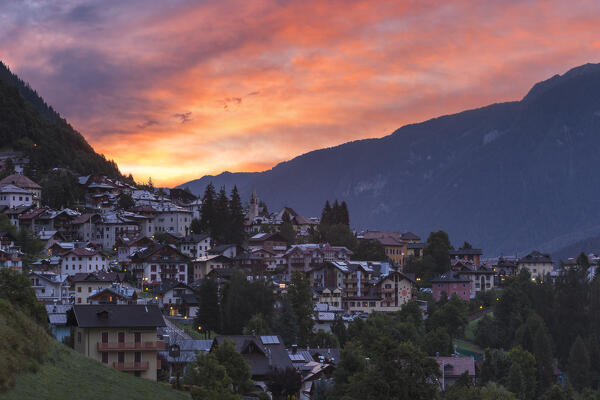 Fire sunrise on Mezzana village, Sole valley (val di Sole), Trento province, Trentino-Alto Adige, Italy, Europe