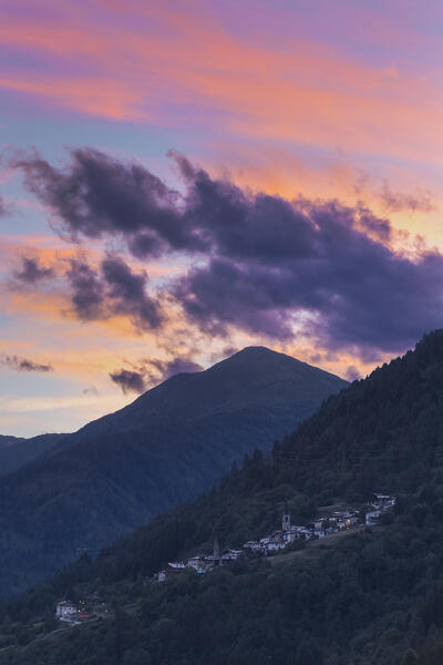 Sunset on Termenago village and Cima Boai, Pellizzano, Sole valley (val di Sole), Trento province, Trentino-Alto Adige, Italy, Europe