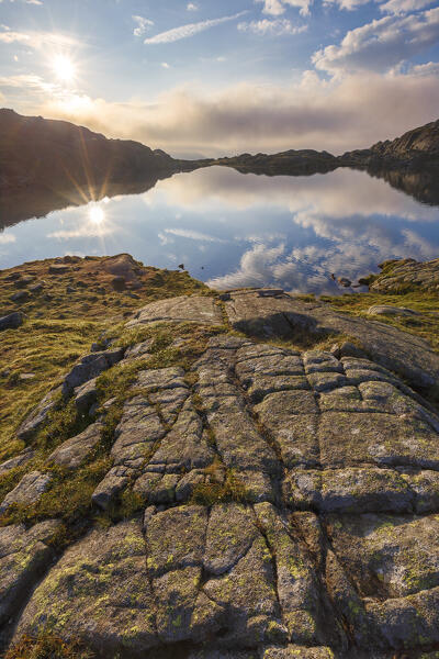 First light on Nero lake (lago Nero), Nambrone valley (val Nambrone), Trento province, Trentino-Alto Adige, Italy, Europe