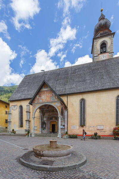 Mom and daughter walk in San Maria square, Pellizzano, Sole valley (val di Sole), Trento province, Trentino-Alto Adige, Italy, Europe (MR)