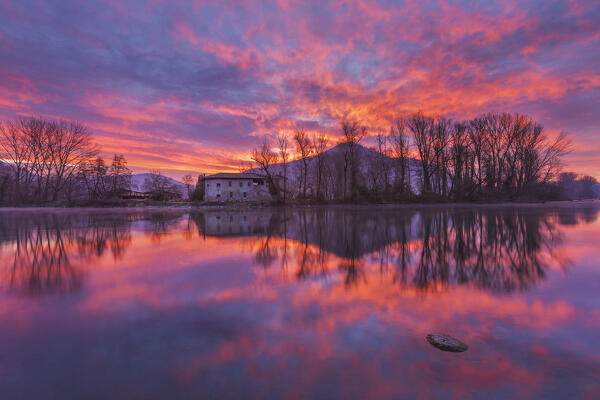 Fire sunrise on the Adda river, Brivio, Lecco province, Lombardy, Italy, Europe
