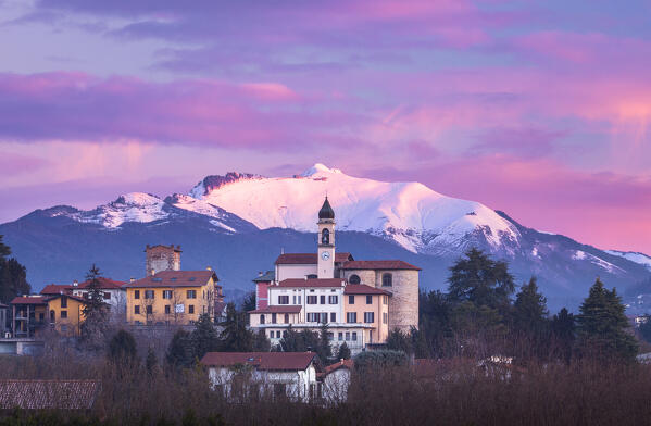 Sunrise on the church of SS Cosma e Damiano and Civello village, Generoso mount snowy in the background, Villa Guardia, Brianza, Como province, Lombardy, Italy, Europe