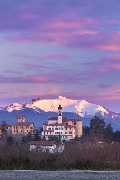 Sunrise on the church of SS Cosma e Damiano and Civello village, Generoso mount snowy in the background, Villa Guardia, Brianza, Como province, Lombardy, Italy, Europe