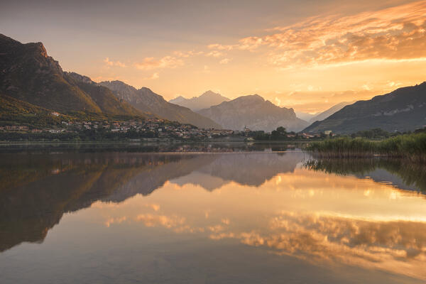Sunrise on lake Annone with Lecco mountains reflected, Brianza, Lecco province, Lombardy, Italy, Europe