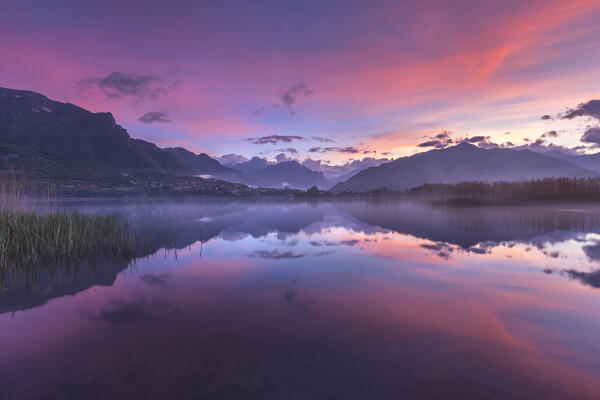 Pink sunrise on lake Annone, Brianza, Lecco province, Lombardy, Italy, Europe