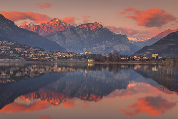 Sunset on lake Annone with Civate village and Lecco mountains reflected, Brianza, Lecco province, Lombardy, Italy, Europe