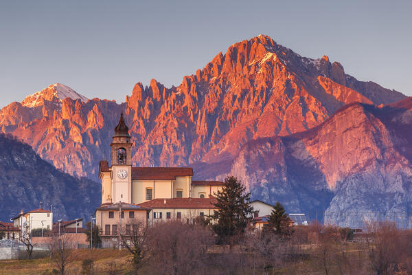 Sunset on Grigna mount (Grignetta) and Civate church, Civate village, lake Annone, Brianza, Lecco province, Lombardy, Italy, Europe