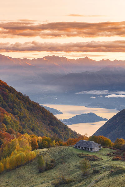 Autumnal sunrise on Lenno and lake Como from Piano delle Alpi. Cerano d'Intelvi, Intelvi valley (val d'Intelvi), lake Como, Como province, Lombardy, Italy, Europe