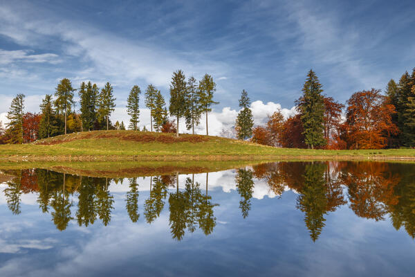 Autumnal reflections on Monte Tellero pond. Ponna Superiore, Intelvi valley (val d'Intelvi), Como province, Lombardy, Italy, Europe