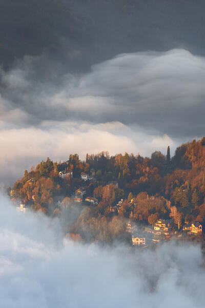 Monte Olimpino town surrounded by the fog, lake Como, Lombardy, Italy, Europe