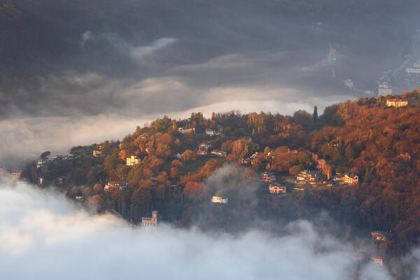 Monte Olimpino town surrounded by the fog, lake Como, Lombardy, Italy, Europe