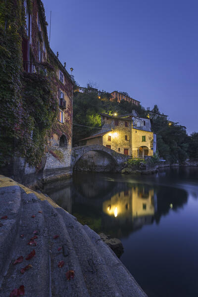 Nesso village illuminate at Dawn in the autumn time, lake Como, Como province, Lombardy, Italy, Europe