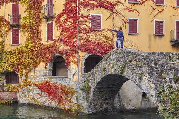 Mother and soon looks lake Como from Nesso village in autumn time, Como province, Lombardy, Italy, Europe (MR)
