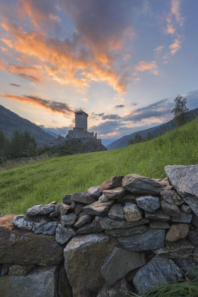 Sunrise on St. Michael castle (Castello di San Michele), Ossana village, Sun valley (val di Sole), Trento province, Trentino alto adige, Italy, Europe