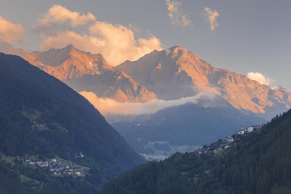 Sunrise on Gruppo Ortles-Cevedale alps and Strombiano village, Stelvio National Park, Rhaetian Alps. View from Ossana village, Sun valley (val di Sole), Trento province, Trentino alto adige, Italy, Europe