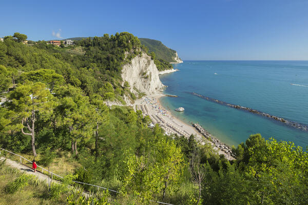 A tourist looks panorama of the Spiaggia del Frate beach, Adriatic sea, Numana, Riviera del Conero, Ancona province, Marche, Italy, Europe (MR)