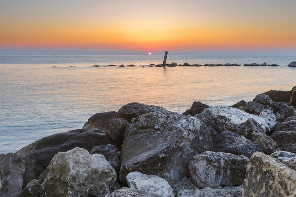 Sunrise on Adriatic sea from Spiaggia del Frate beach, Numana, Riviera del Conero, Ancona province, Marche, Italy, Europe