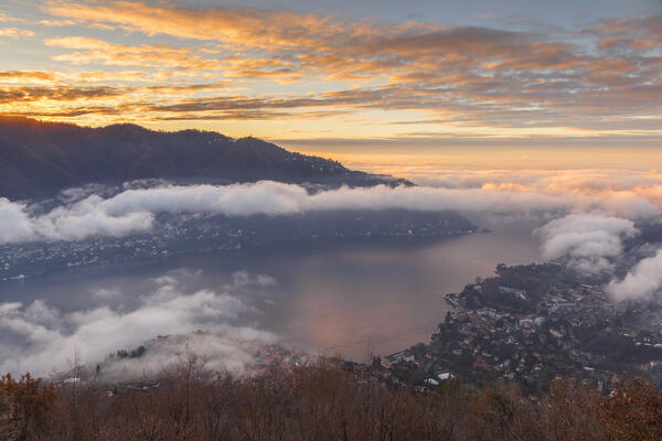 Cloudy sunrise on lake Como, Brunate and Cernobbio town, Como province, Lombardy, Italy, Europe