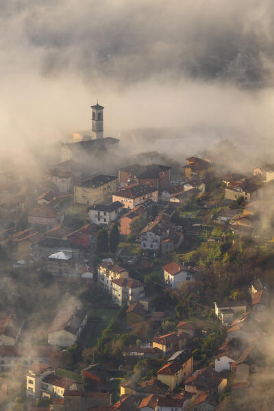 Cernobbio town wrapped by the morning fog, lake Como, Como province, Lombardy, Italy, Europe