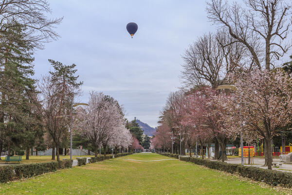 Balloon over Como city near Volta Temple (tempio voltiano), lake Como, Lombardy, Italy, Europe