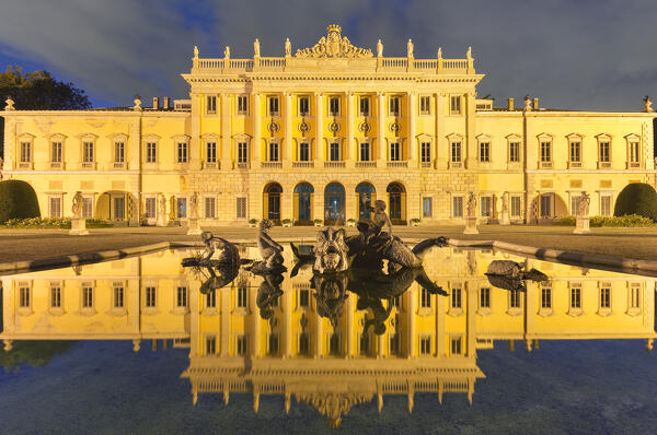 Villa Olmo reflected in its Monumental Fountain illuminated in the evening, lake Como, Como city, Lombardy, Italy, Europe