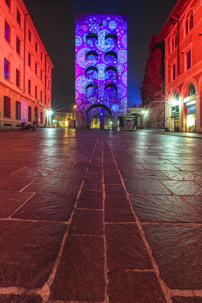 Porta Torre tower illuminated by night in the Christmas time, Città dei Balocchi, Como city, Lombardy, Italy, Europe