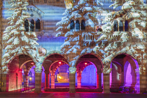Broletto and Santa Maria Assunta cathedral illuminated and animated at night in the Christmas time, Città dei Balocchi, Como city, Lombardy, Italy, Europe