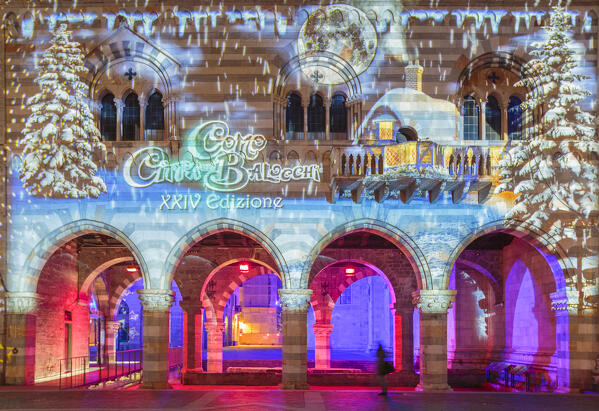 Broletto and Santa Maria Assunta cathedral illuminated and animated at night in the Christmas time, Città dei Balocchi, Como city, Lombardy, Italy, Europe