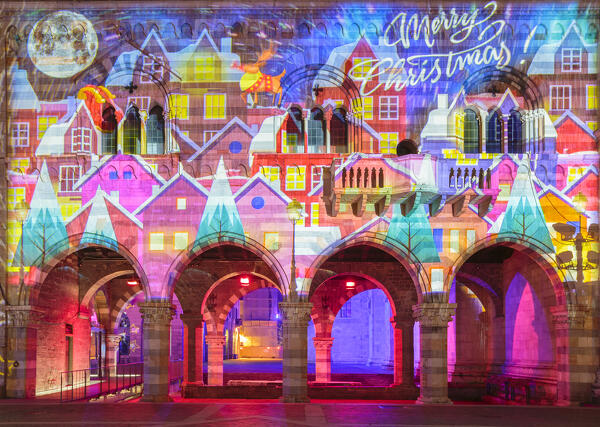 Broletto and Santa Maria Assunta cathedral illuminated and animated at night in the Christmas time, Città dei Balocchi, Como city, Lombardy, Italy, Europe