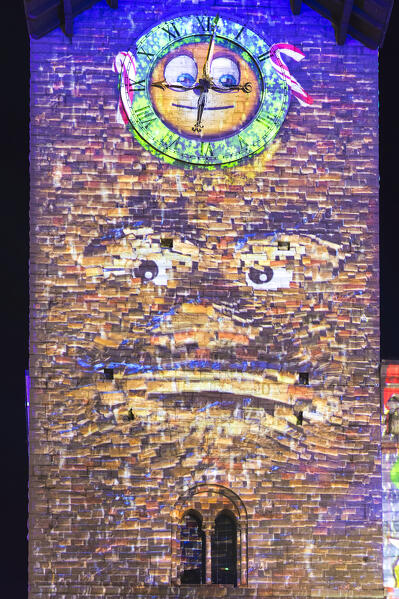 Broletto tower illuminated and animated at night during the Christmas time, Città dei Balocchi, Como city, Lombardy, Italy, Europe