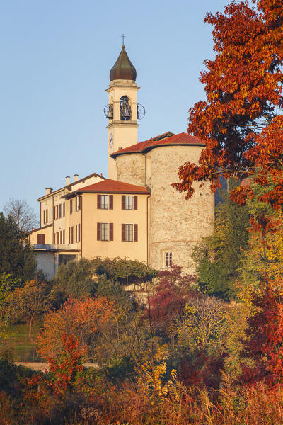 Autumnal trees frame the Villa Guardia church. Brianza, Como province, Lombardy, Italy, Europe