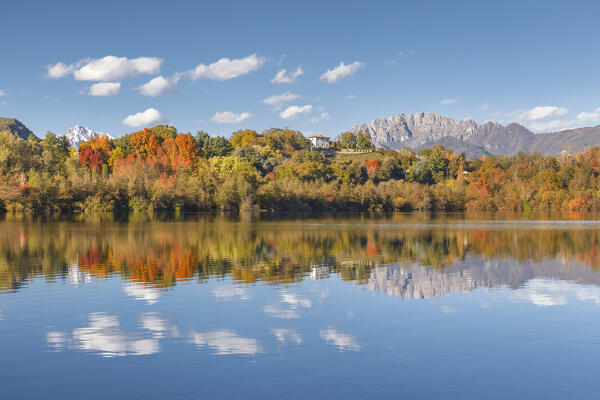 Autumn reflections on Sartirana lake and Resegone mount, Sartirana, Merate, Brianza, Lecco province, Lombardy, Italy, Europe