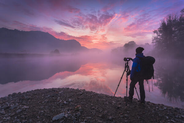 Photographer captures pink sunrise over Adda River, Airuno, Brianza, Lecco province, Lombardy, Italy, Europe (MR)