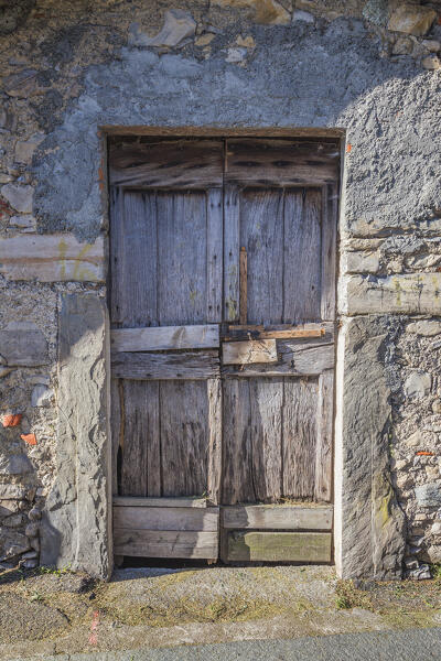 A wooden door of a old house along the 