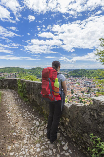 Hiker looks Como city from the St. Donato hermitage (Eremo di San Donato), lake Como, Lombardy, Italy, Europe (MR)