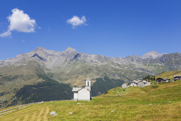 A summer view of San Rocco church in the meadows of the Altopiano degli Andossi, Madesimo, Spluga valley, Sondrio province, Lombardy, Italy, Europe