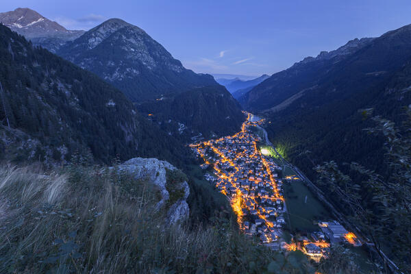 Dusk on Campodolcino village illuminated at evening and Spluga valley, Sondrio province, Lombardy, Italy, Europe