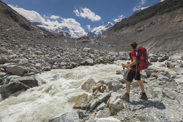 Hiker admire Morteratsch glacier, Bernina group, Morteratsch valley, Engadine, Switzerland, Europe (MR)