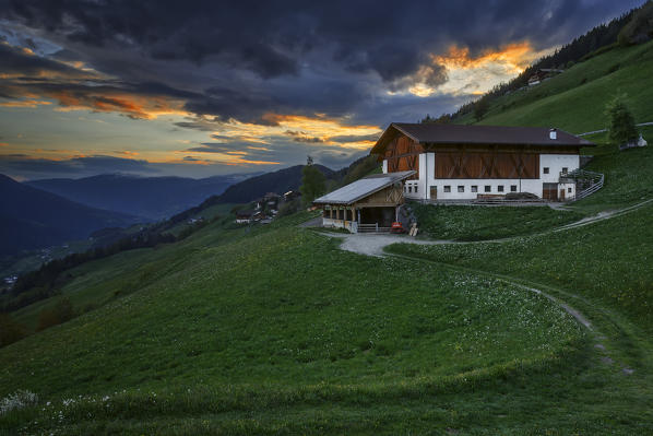Last light on a farm in the Funes valley, Coll, Santa Magdalena, South Tyrol region, Trentino Alto Adige, Bolzano province, Italy, Europe