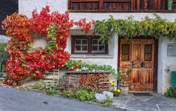 Autumn facade of a house, Coltura, Stampa, Maloja region, Canton of Graubunden, Bregaglia valley, Switzerland, Europe