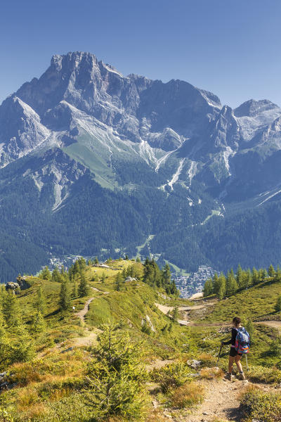 Hiker walks on the track, Pale di San Martino Dolomites, San Martino di Castrozza, Trento province, Trentino Alto Adige, Italy, Europe (MR)