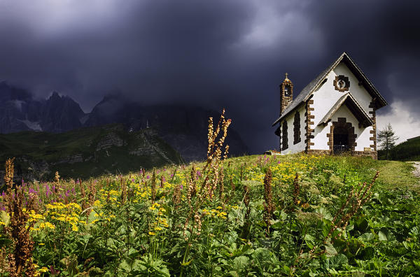 Sunset on Church of Madonna Assunta, Rolle Pass, Pale di San Martino Dolomites, Trento province, Trentino Alto Adige, Italy, Europe