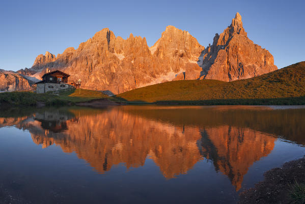 Enrosadira on Pale di San Martino Dolomites reflecting on the lake of Segantini hut, Rolle Pass, Trento province, Trentino Alto Adige, Italy, Europe