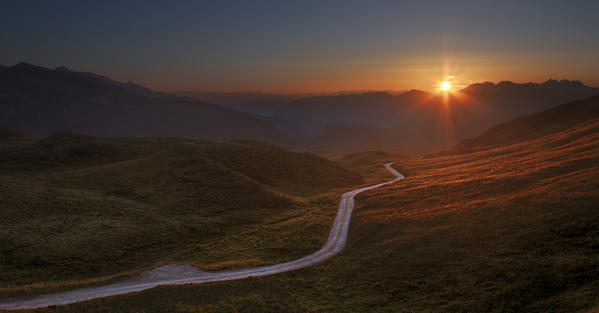 Sunset on the track of Rolle Pass, Trento province, Trentino Alto Adige, Italy, Europe