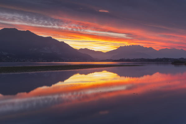 Lecco mountains on fire, sunrise on lake Pusiano, Lecco province, Brianza, Lombardy, Italy, Europe