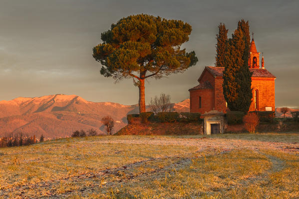 Sunrise on red church of Pomelasca and Bolettone mount, Inverigo, Como province, Brianza, Lombardy, Italy, Europe