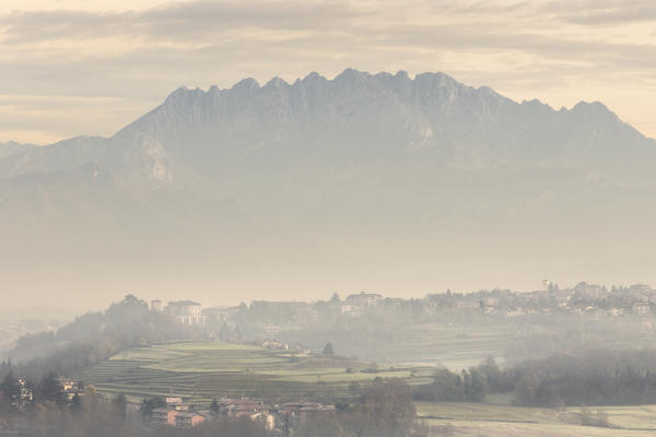 Foggy sunrise on Costamasnaga and Resegone mount, Brianza, Lecco province, Lombardy, Italy, Europe